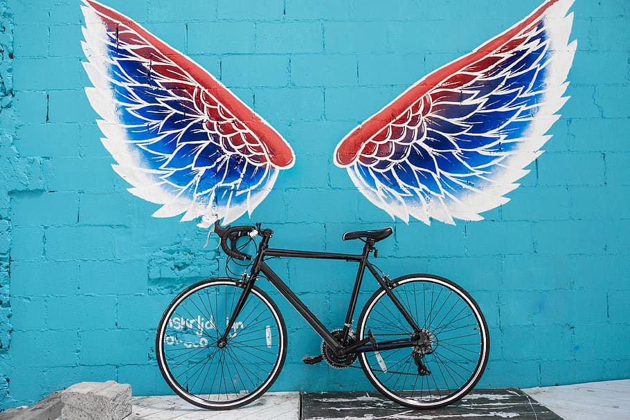 HD wallpaper: Black Road Bike Leaning on Red-blue-and-white Wing Graffiti  Wall | Wallpaper Flare