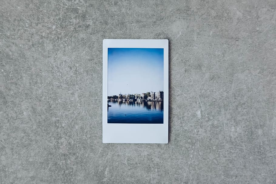 white photo frame, table, vintage, polaroid, blue, texture, sky