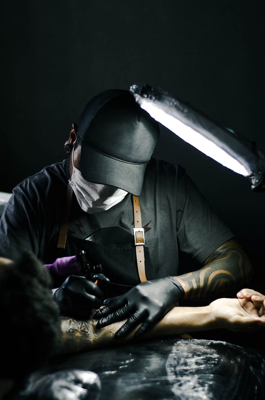 HD wallpaper: Tattoo artist in black gloves drawing a tattoo on a person's  arm | Wallpaper Flare