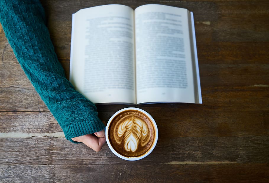 Person Having Cup of Latte While Reading Book, background, beverage HD wallpaper
