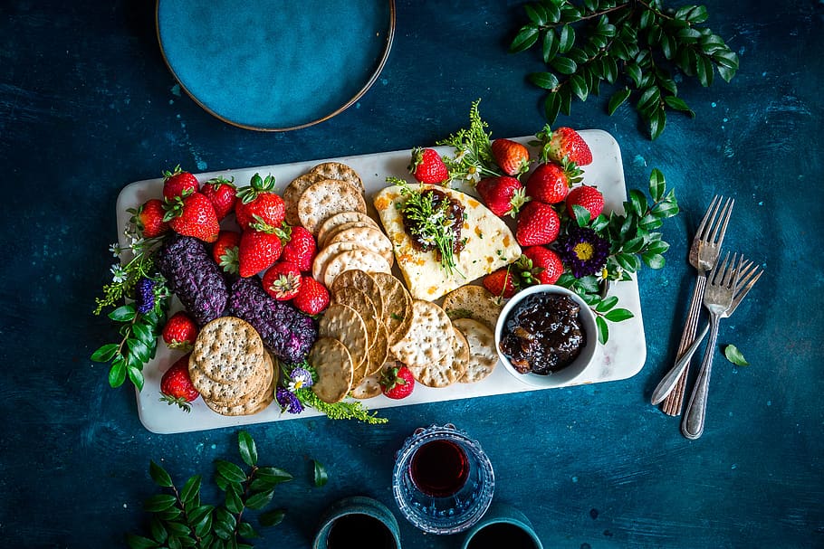 strawberries, biscuit, crackers, tea, drink, wine, foods, table