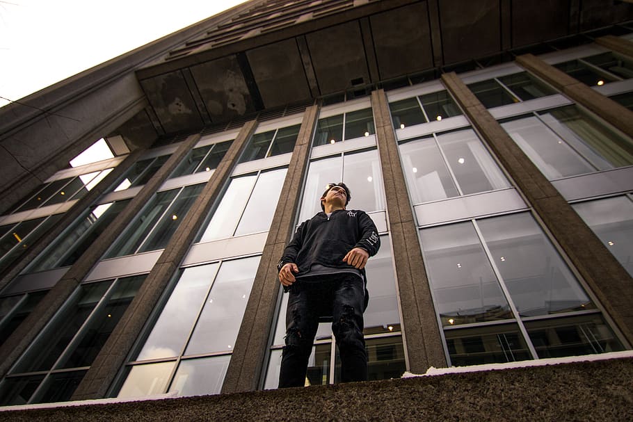 man standing near window, male, facade, building, tower, lights HD wallpaper