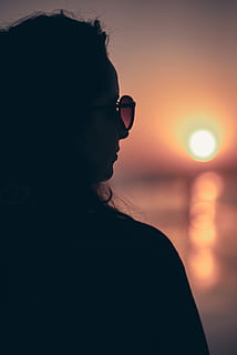 Silhouette Photo of Woman, back view, beach, blur, dawn, depth of field HD wallpaper