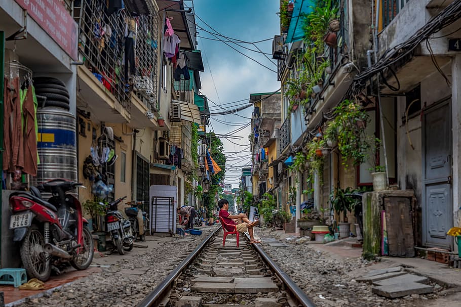 man sitting on railway, railroad track, architecture, rail transportation HD wallpaper
