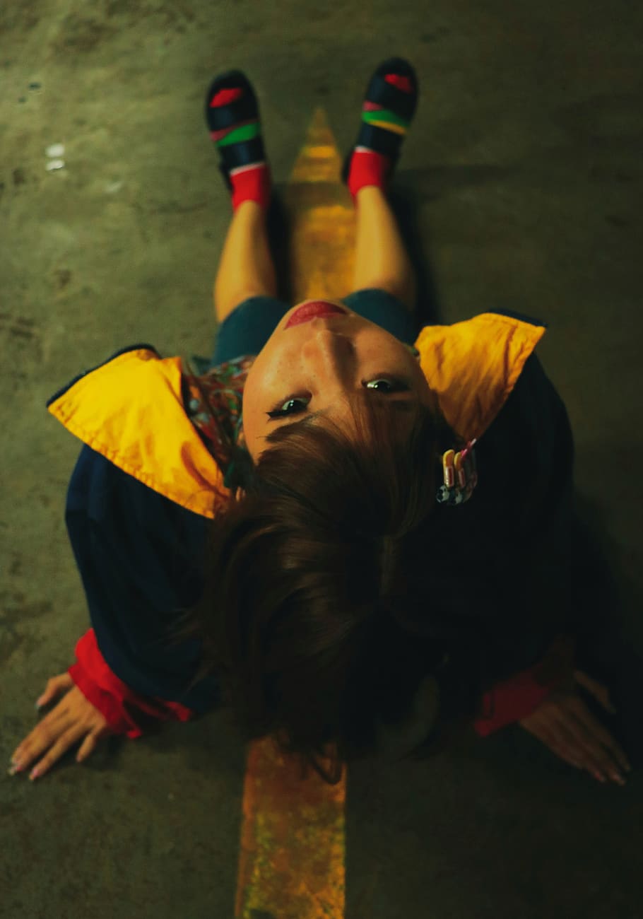 girl sitting on floor wearing yellow and black jacket, person, HD wallpaper