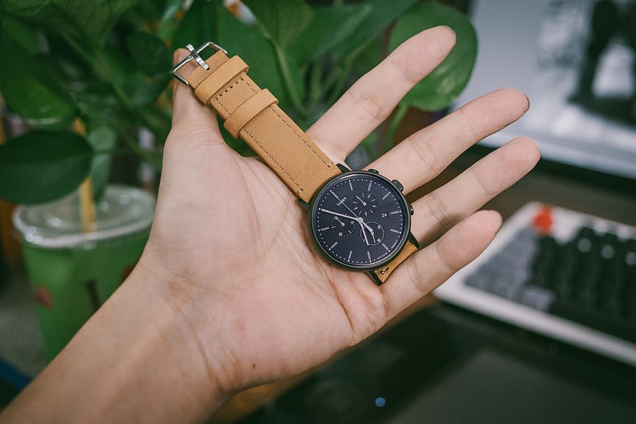 Person Holding Black Chronograph Watch With Brown Leather Strap HD wallpaper