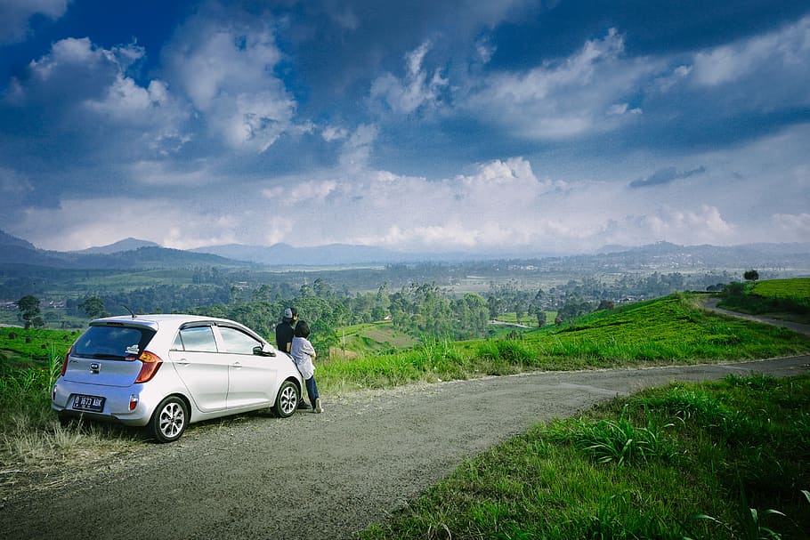 Photo of Man and Woman Beside Gray 5-door Hatchback, car, clouds HD wallpaper