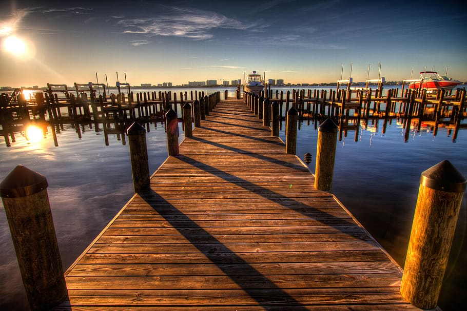 Brown Wooden Dock on Blue Water Under White Clouds and Blue Sky during Daytime HD wallpaper