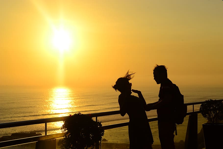 peru, lima district, sunset, couple, view, water, sky, two people HD wallpaper