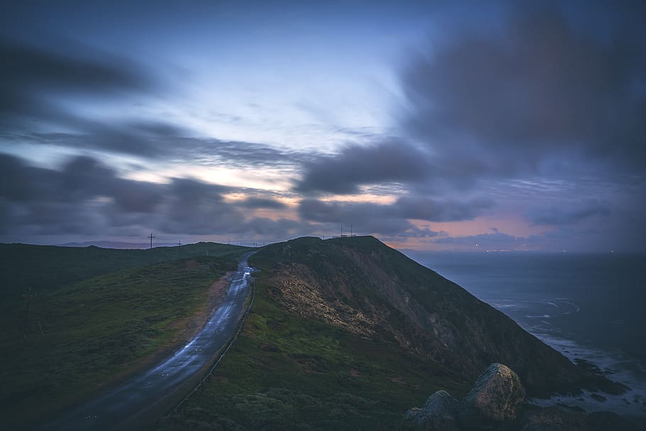 green terrain and gray clouds, sky, cloud - sky, scenics - nature HD wallpaper