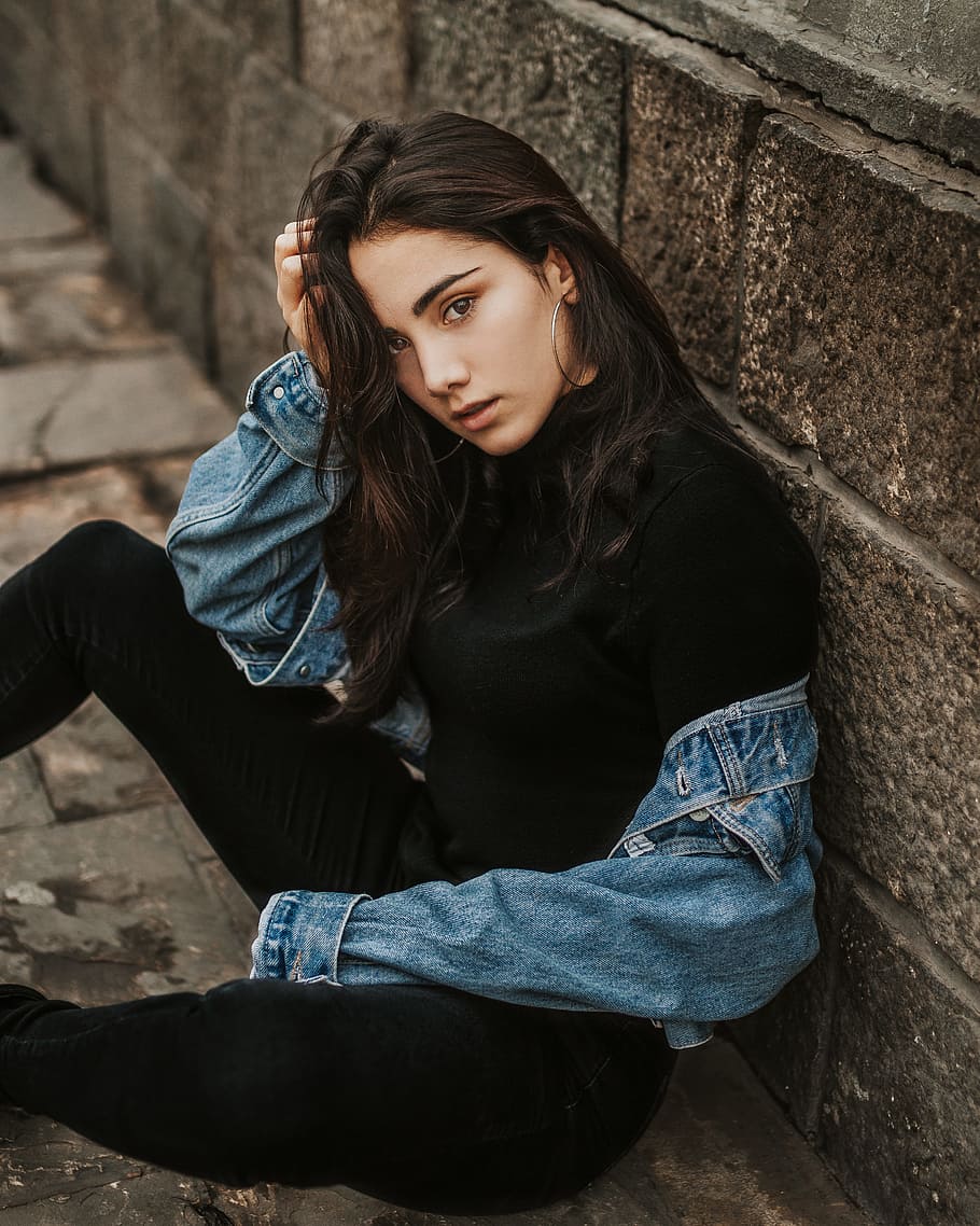 woman leaning on brown concrete wall, one person, young adult HD wallpaper