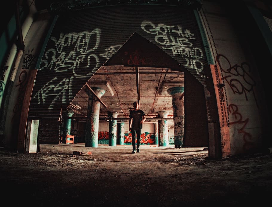 Man About to Walk Near Broken Roller Shutter, abandoned, abandoned building HD wallpaper