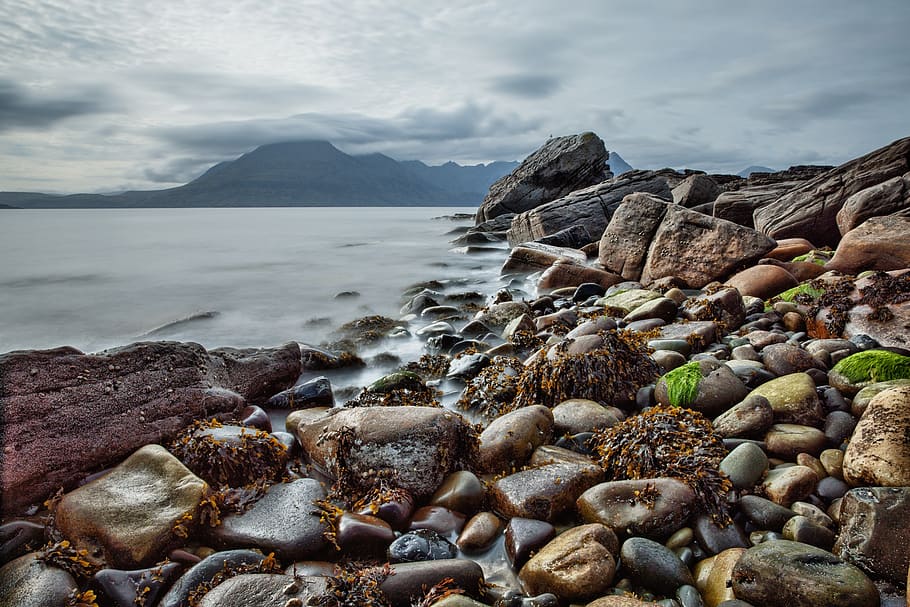 Brown Black and Gray Rocks Near the Shore, clouds, mountain, ocean HD wallpaper