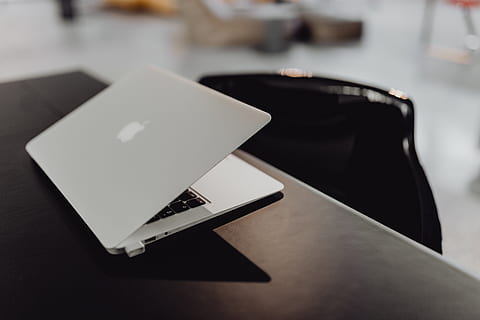 Stylish workspace with MacBook computer on home or studio, tech HD wallpaper