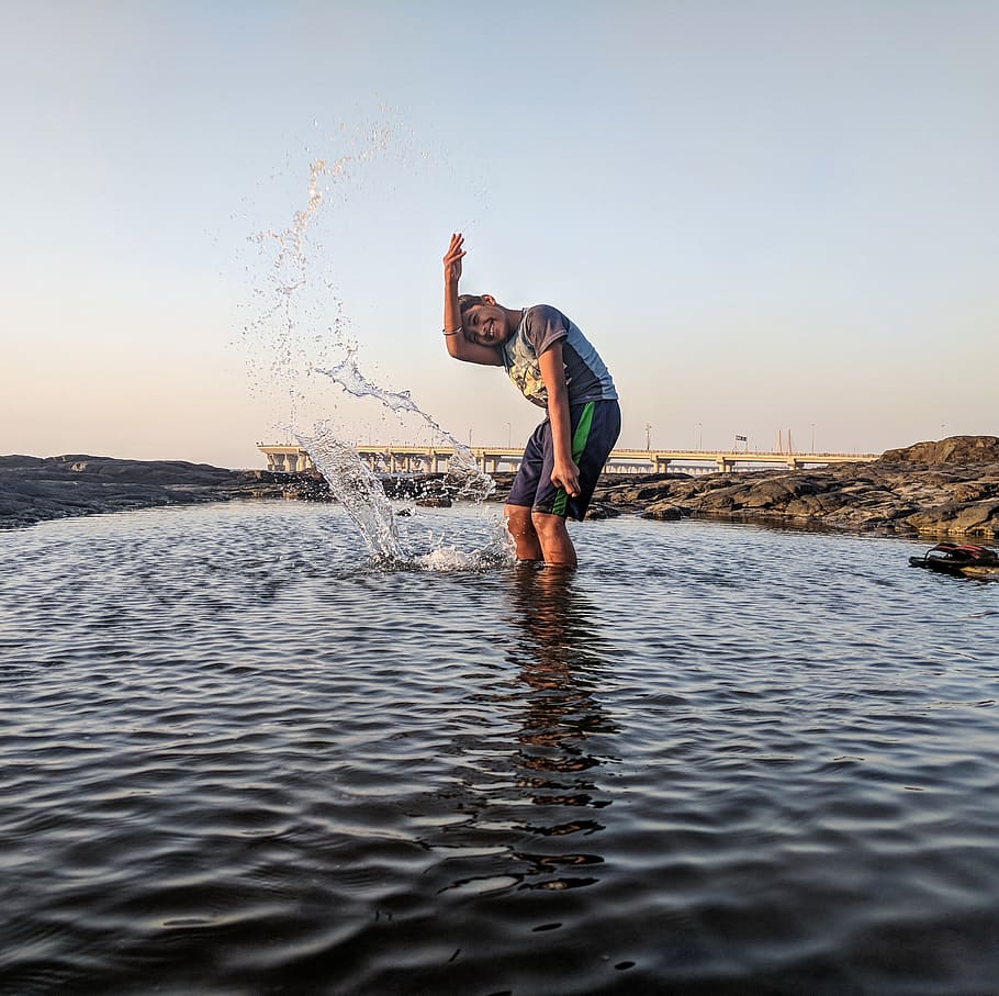 Boy Playing on Body of Water, action, beach, child, fun, kid HD wallpaper