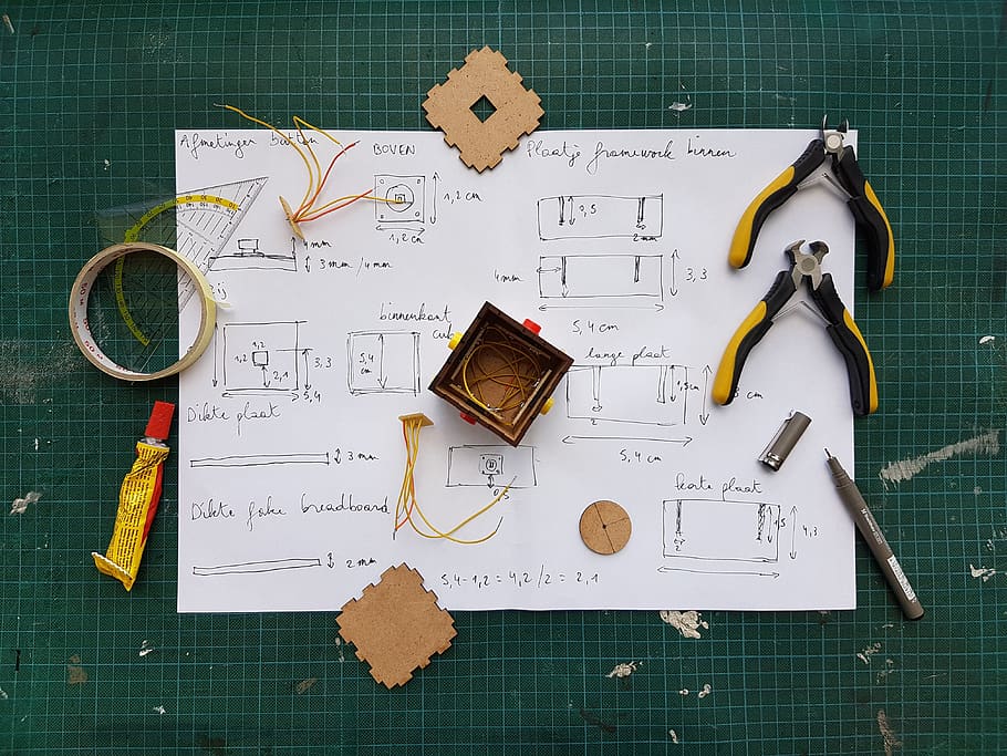 White Diagram Paper Under Pliers, close-up, drawing, pen, planning HD wallpaper