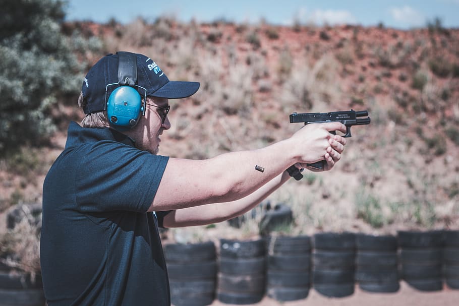 Photo of Man Firing Pistol, accuracy, action, adult, blur, depth of field, HD wallpaper