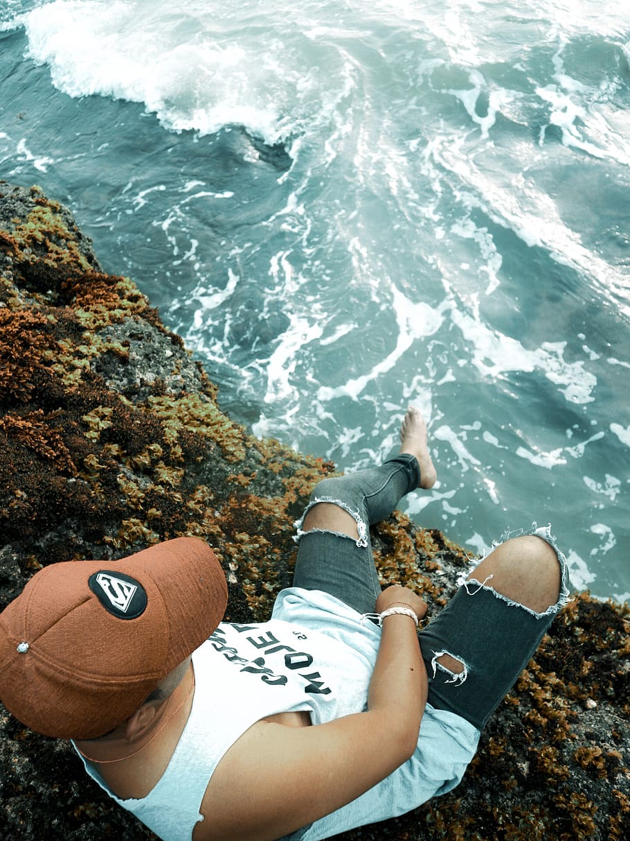 White Tank Top, cap, cliff, daylight, landscape, man, ocean, person HD wallpaper
