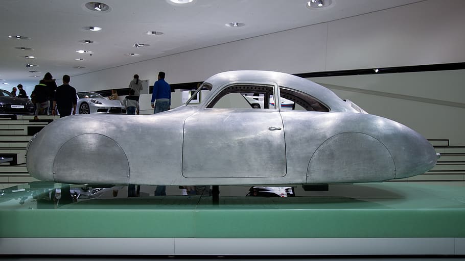classic gray coupe display on green platform, person, human, tire HD wallpaper
