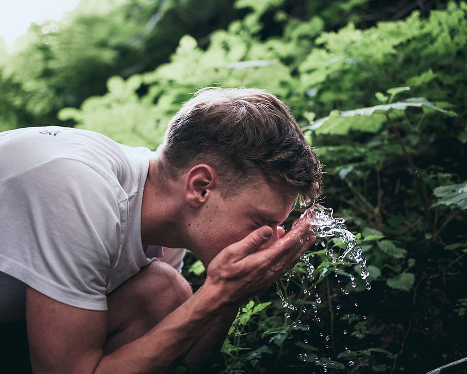 man washing his face, one person, real people, plant, young men HD wallpaper