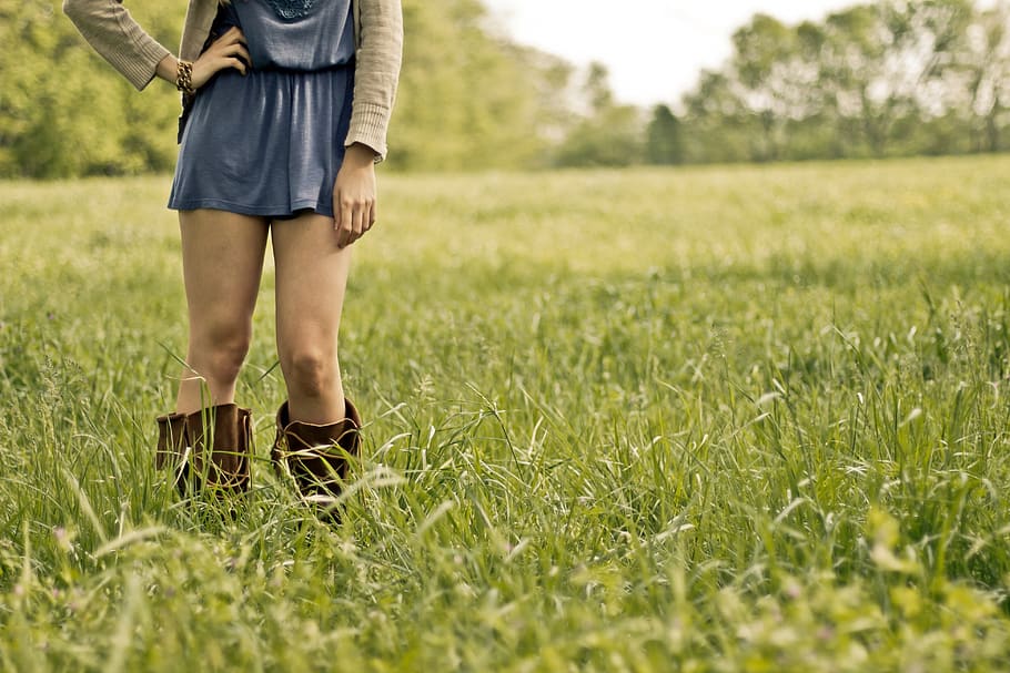 Person Wearing Brown Boots Standing on Green Grass Ground, field HD wallpaper
