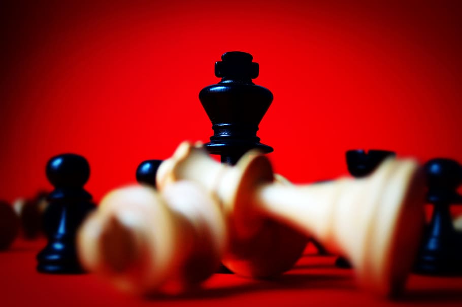 Chess Pieces Red Lined Up On A Dark Board Backgrounds