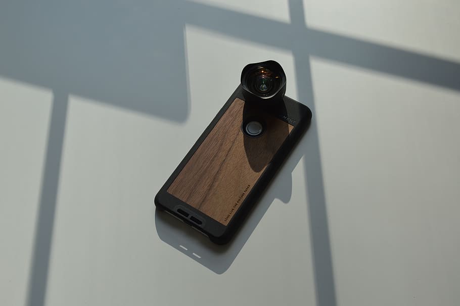 brown and black smartphone with lens, electronics, mobile phone