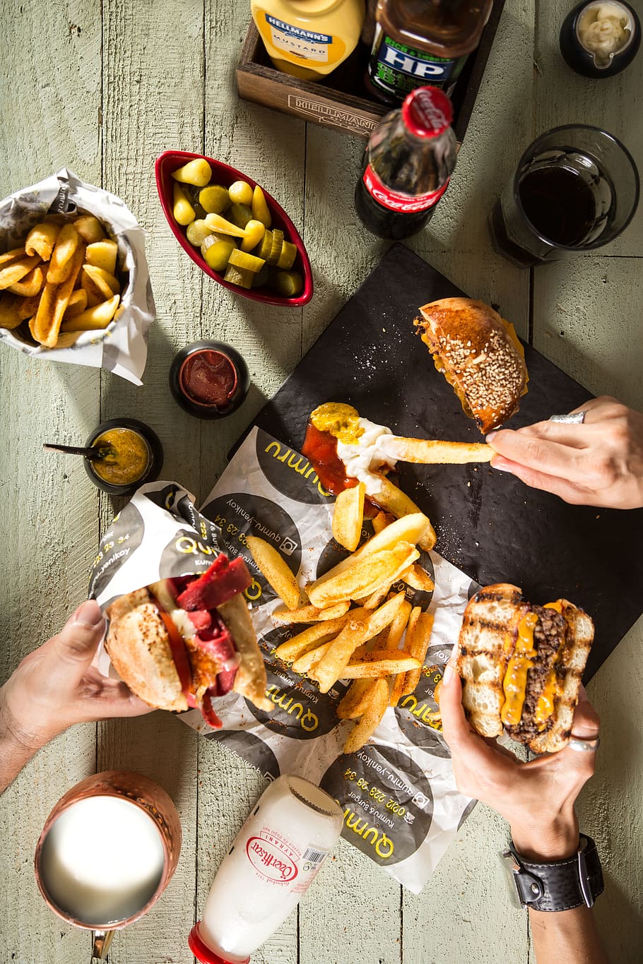 Two Person Holding Burgers, cola, color, dip, drink, eating, food HD wallpaper