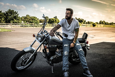 Man Sitting on Black Cruiser Motorcycle, biker, daylight, fence HD wallpaper