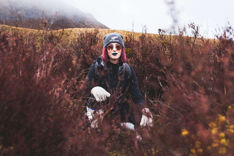 Photo of Woman With Purple Hair Squat Posing in the Middle of Bushes HD wallpaper