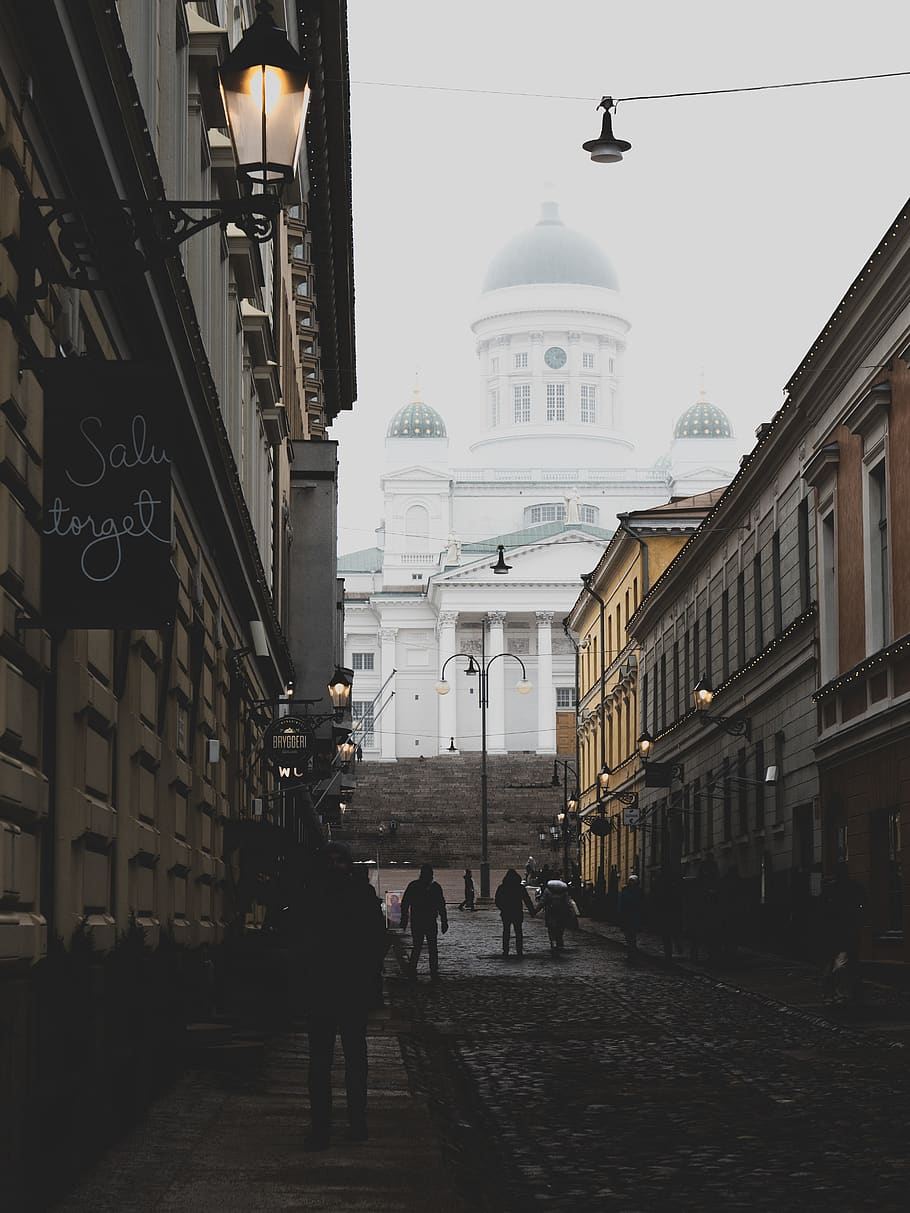 people walking between brown buildings, walkway, path, human HD wallpaper