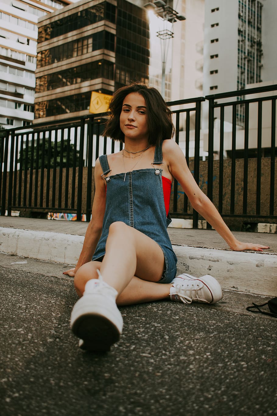 Woman Sitting on Road Near Building, attractive, beautiful, beauty