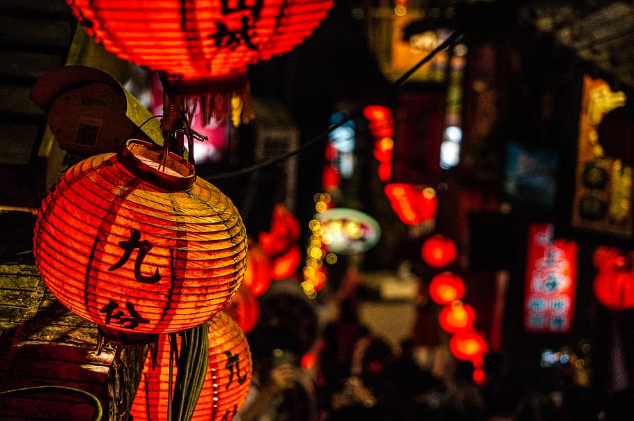orange and black lanterns, lamp, festival, crowd, helmet, apparel
