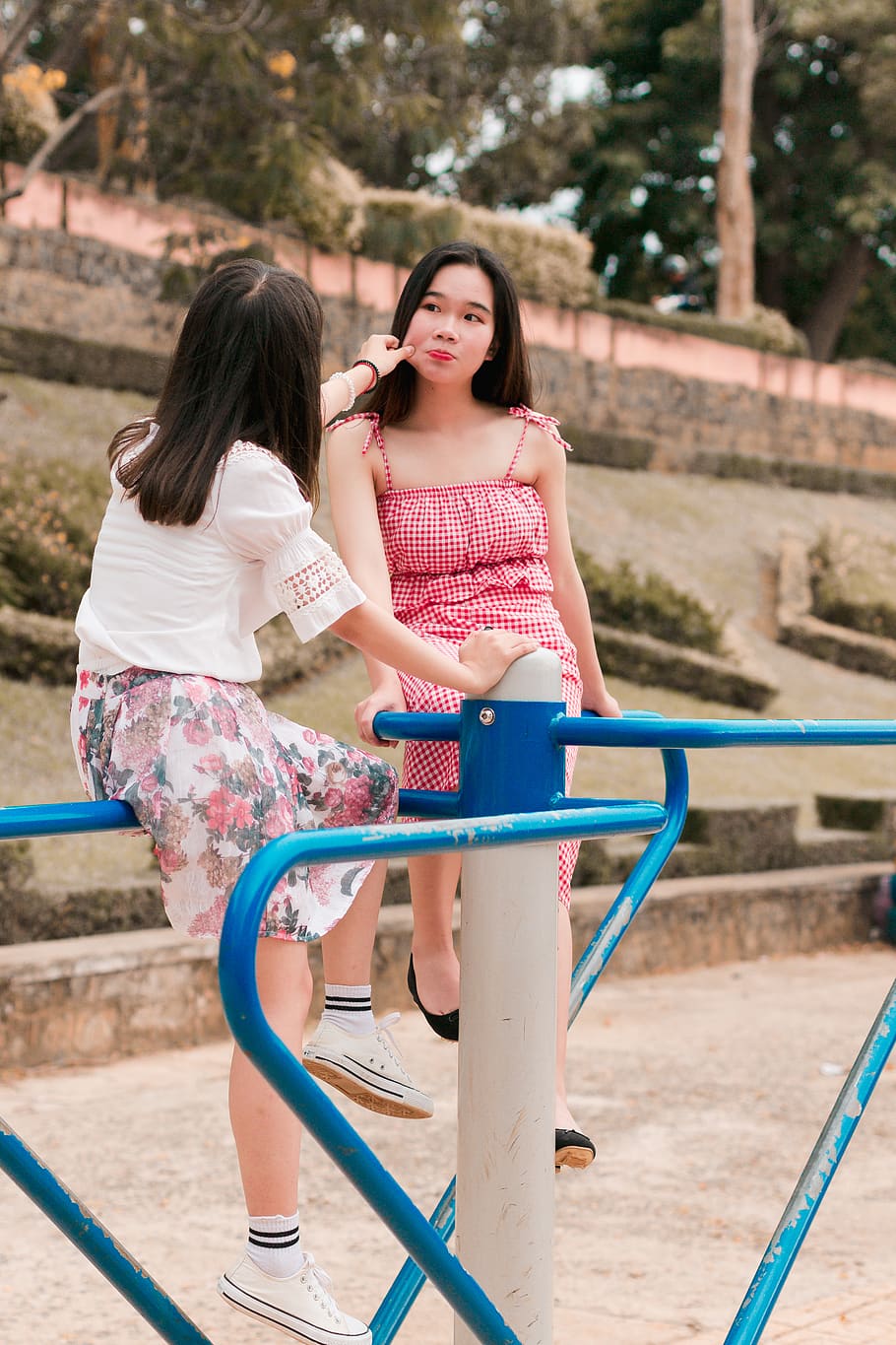 Two Woman on Mary Go Round, beautiful, daylight, daytime, girls