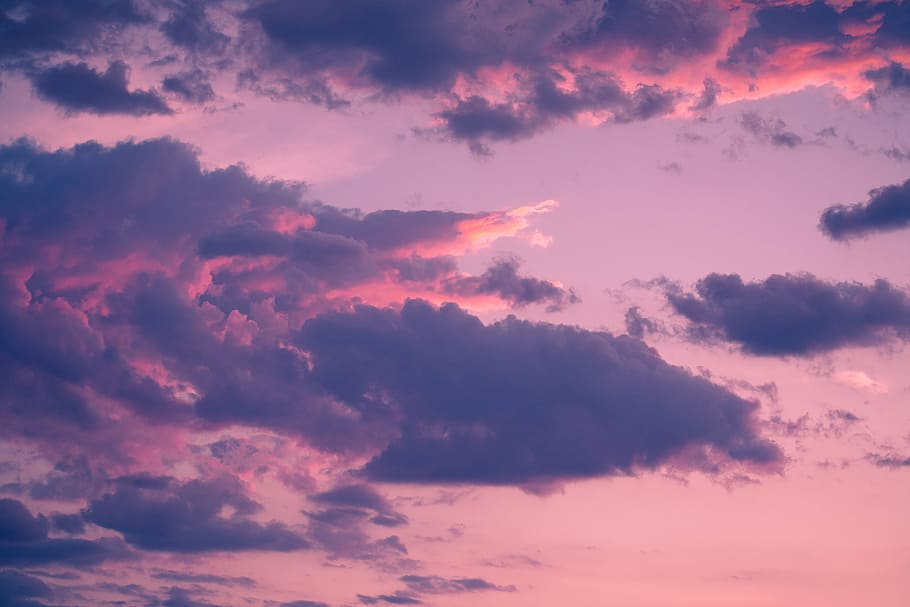 clouds illuminated with sunlight at sunset, cloudscape, pink