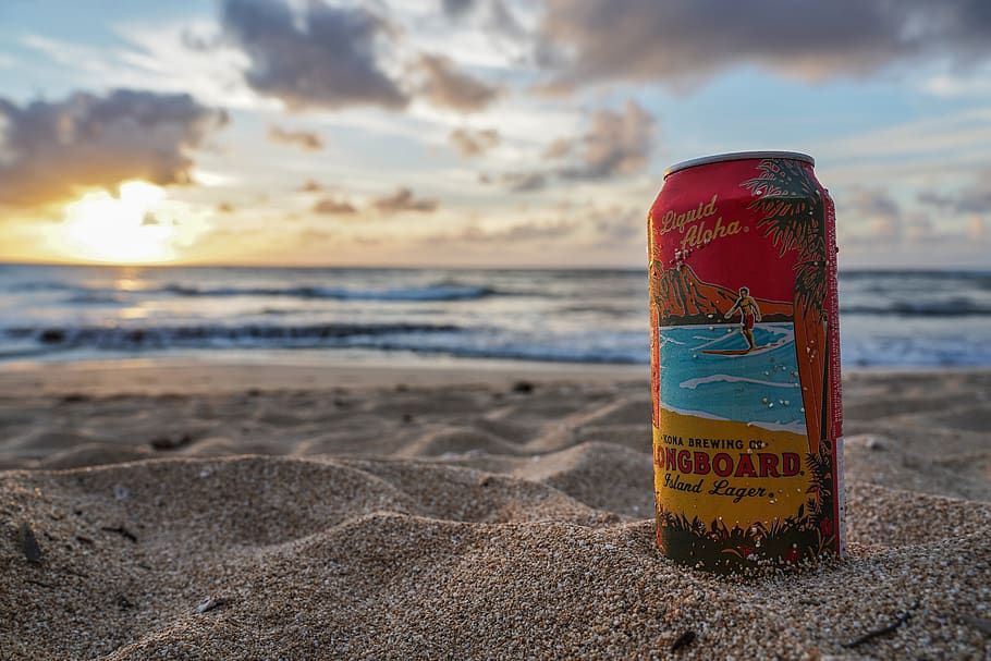 Longboard beverage can on sand by the beach during day, tin, beer, HD wallpaper
