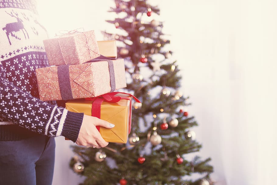 Woman’s hands hold christmas gift boxes. Merry Christmas, celebration HD wallpaper