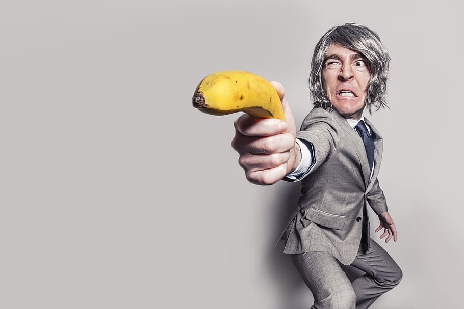 Man in Gray Suit Jacket Holding Yellow Banana Fruit While Making Face, HD wallpaper