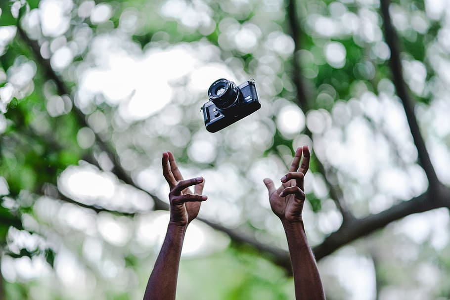 person throwing DSLR camera, hand, film, bokeh, photographer HD wallpaper