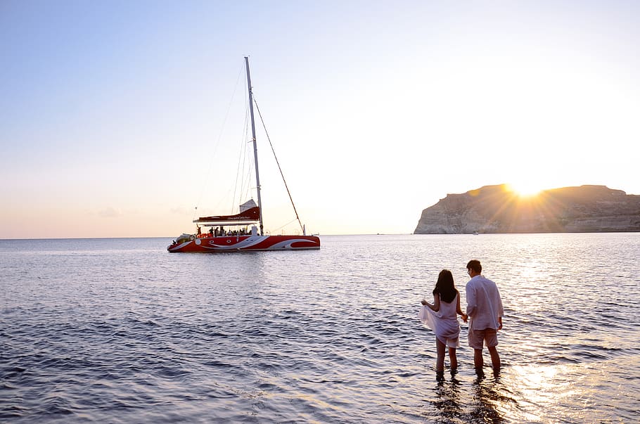 beach, greece, santorini, sunset, couple, water, sea, sky, nautical vessel HD wallpaper