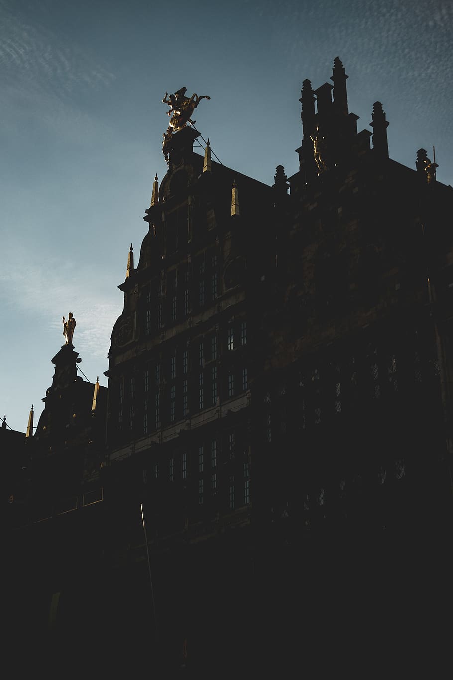 belgium, antwerp, clouds, buildings, gold, statue, dark, window HD wallpaper