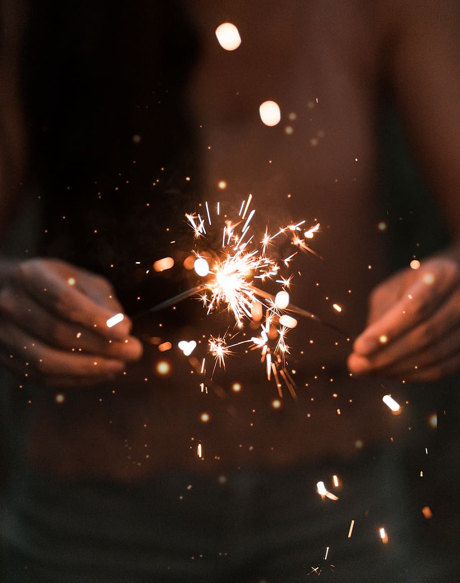 person holding fire works, sparkler, firework, hand, bokeh, blur, HD wallpaper