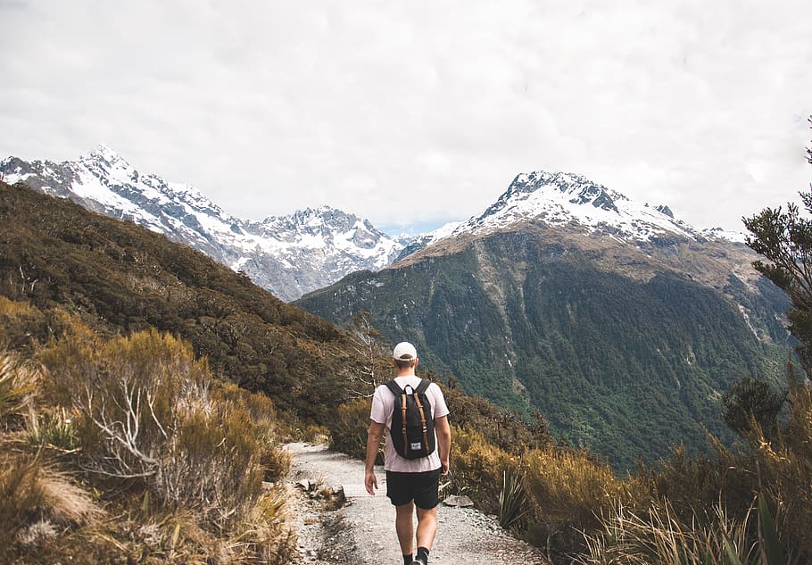 man walking towards mountain during daytime, nature, green, fitness HD wallpaper