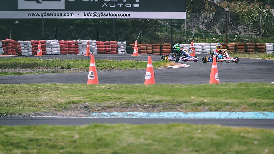 red obstacle cones on track field, asphalt, tarmac, helmet, ecuador HD wallpaper