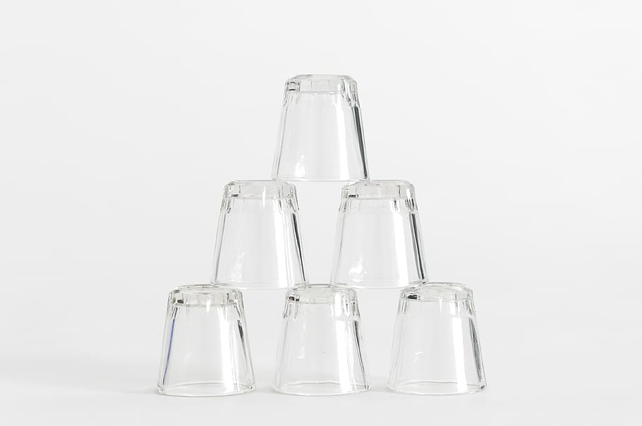 six piled clear shot glasses, studio shot, indoors, white background HD wallpaper