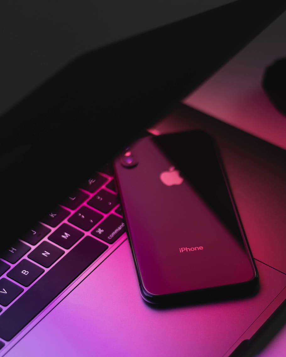 black iPhone X on silver MacBook, cell phone, electronics, mobile phone, HD wallpaper