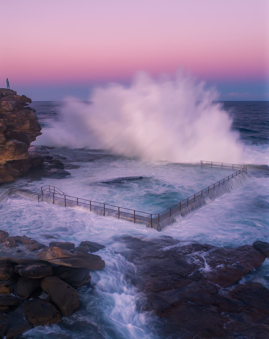 Body of Water Crashing on Black Steel Fence, australia, bay, beach HD wallpaper