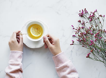 tea, table, flowers, hands, cup and saucer, lemon, fruit, hot drink HD wallpaper