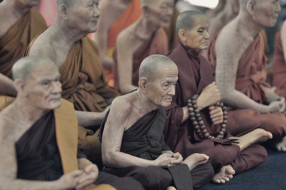 monks sitting on floor while praying, human representation, male likeness HD wallpaper