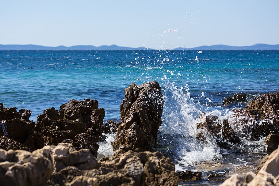 Sea, Beach, water, rock, rock - object, splashing, solid, motion HD wallpaper